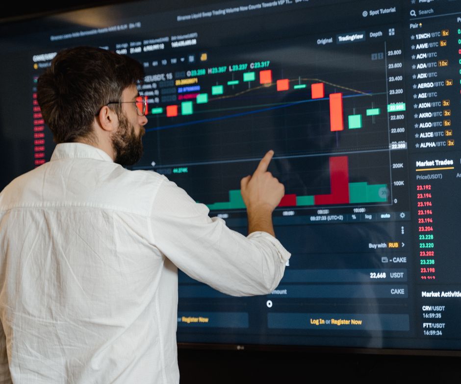 person looking at stock graph and analyzing it